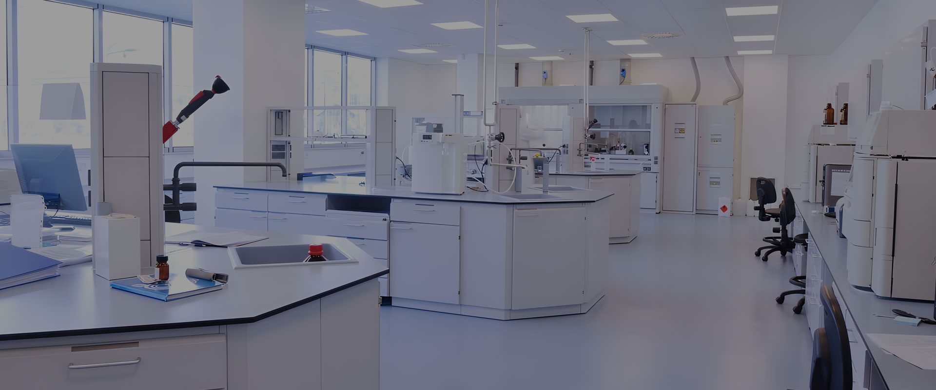 A large room with many different types of lab equipment.